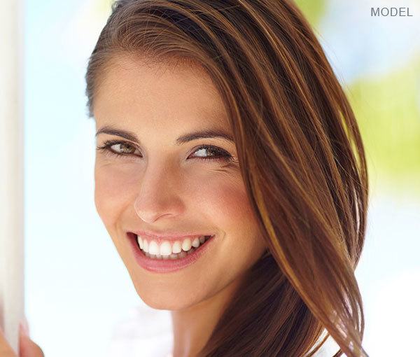 Model at beach smiling