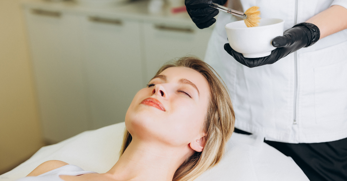 A woman receives a chemical peel.