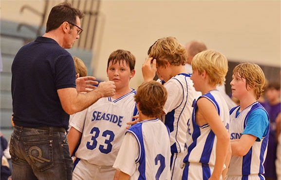 Dr. Burden coaching basketball.