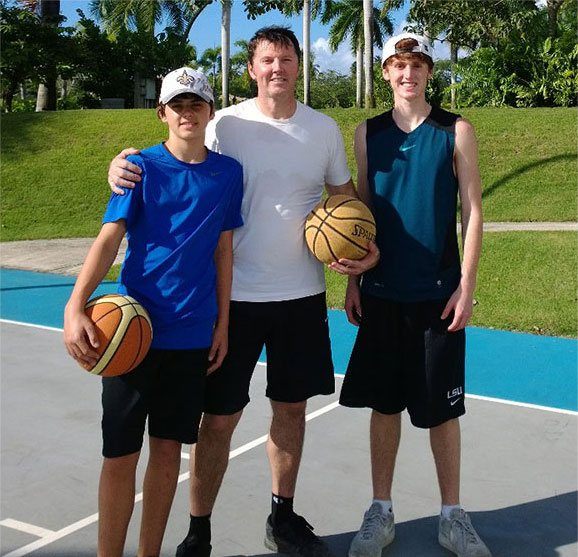 Dr. Burden playing basketball with his kids